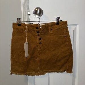 mid rise. corduroy. brown. skirt. frayed bottom. never worn. tag on. 100% cotton